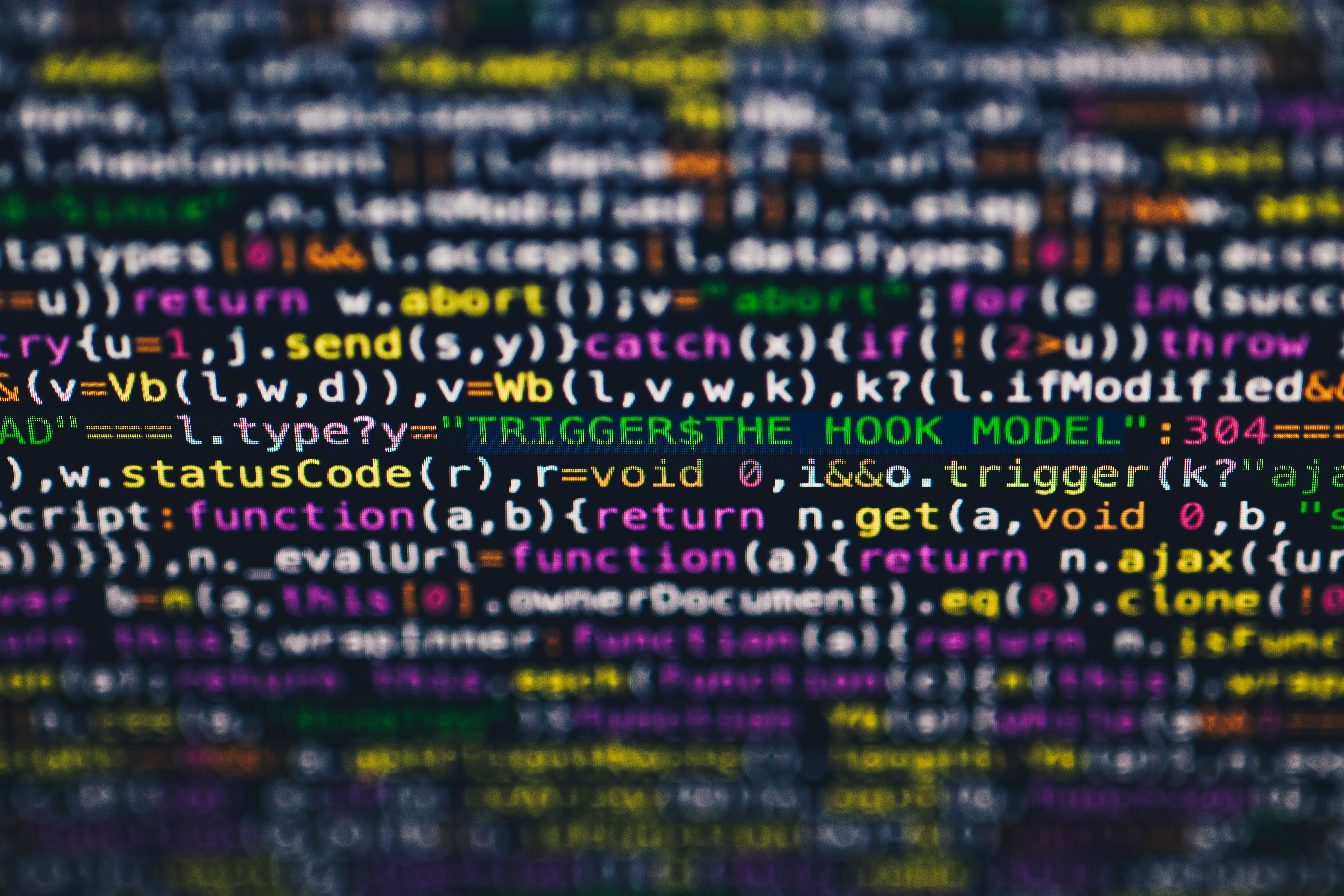 Vibrant colorful programming code on a computer screen representing AI detection algorithms